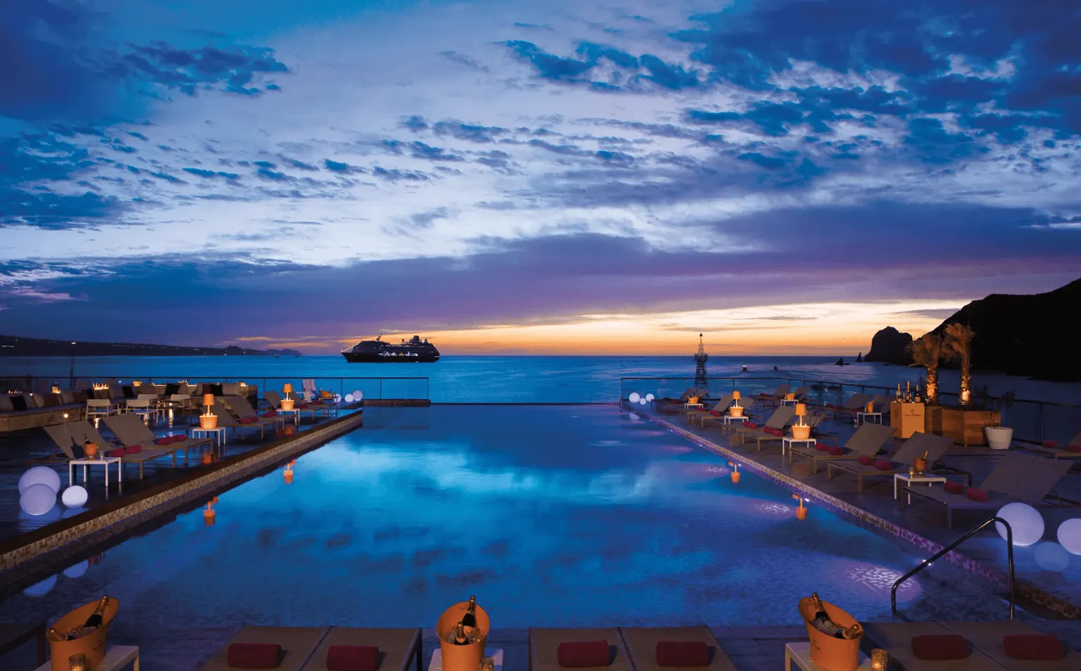  infinity pool looking over the ocean in the moonlight