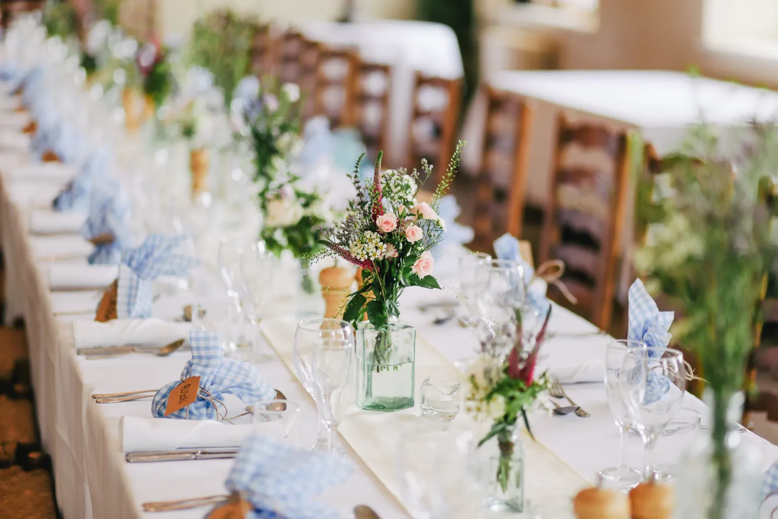 A long table set up for a wedding reception