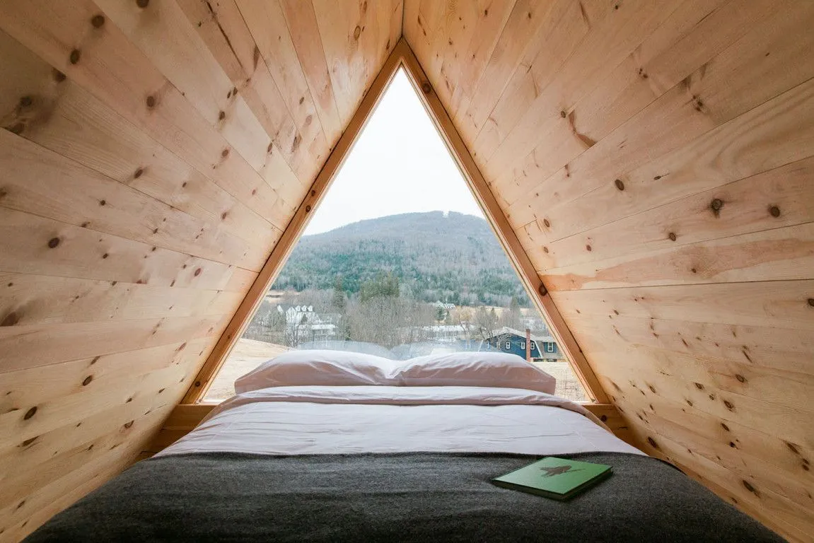 A tent style cabin with a view of the mountains