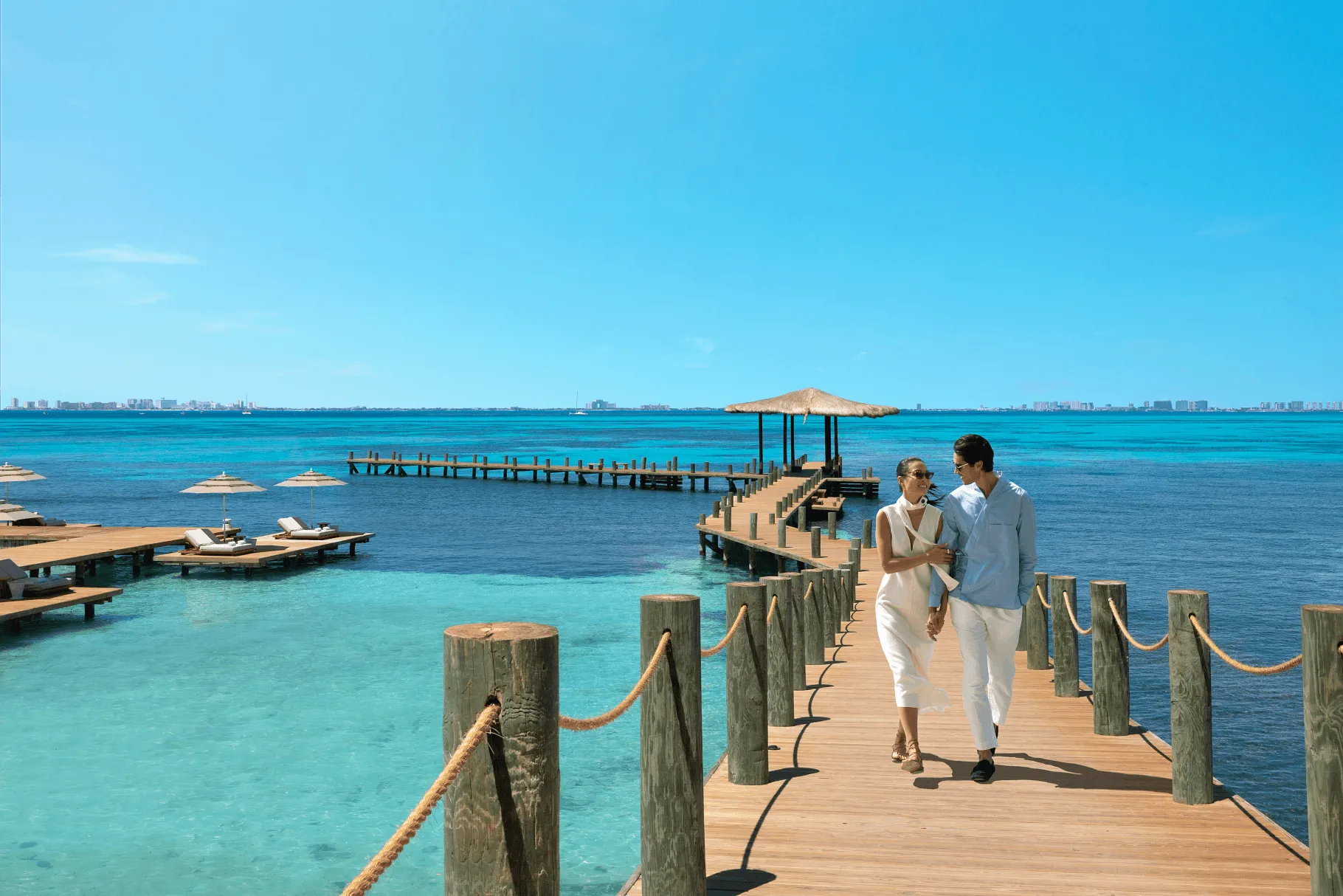 couple embracing and standing outside of resort