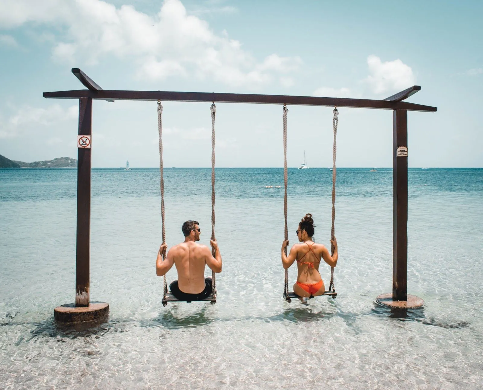 couple swinging on the beach