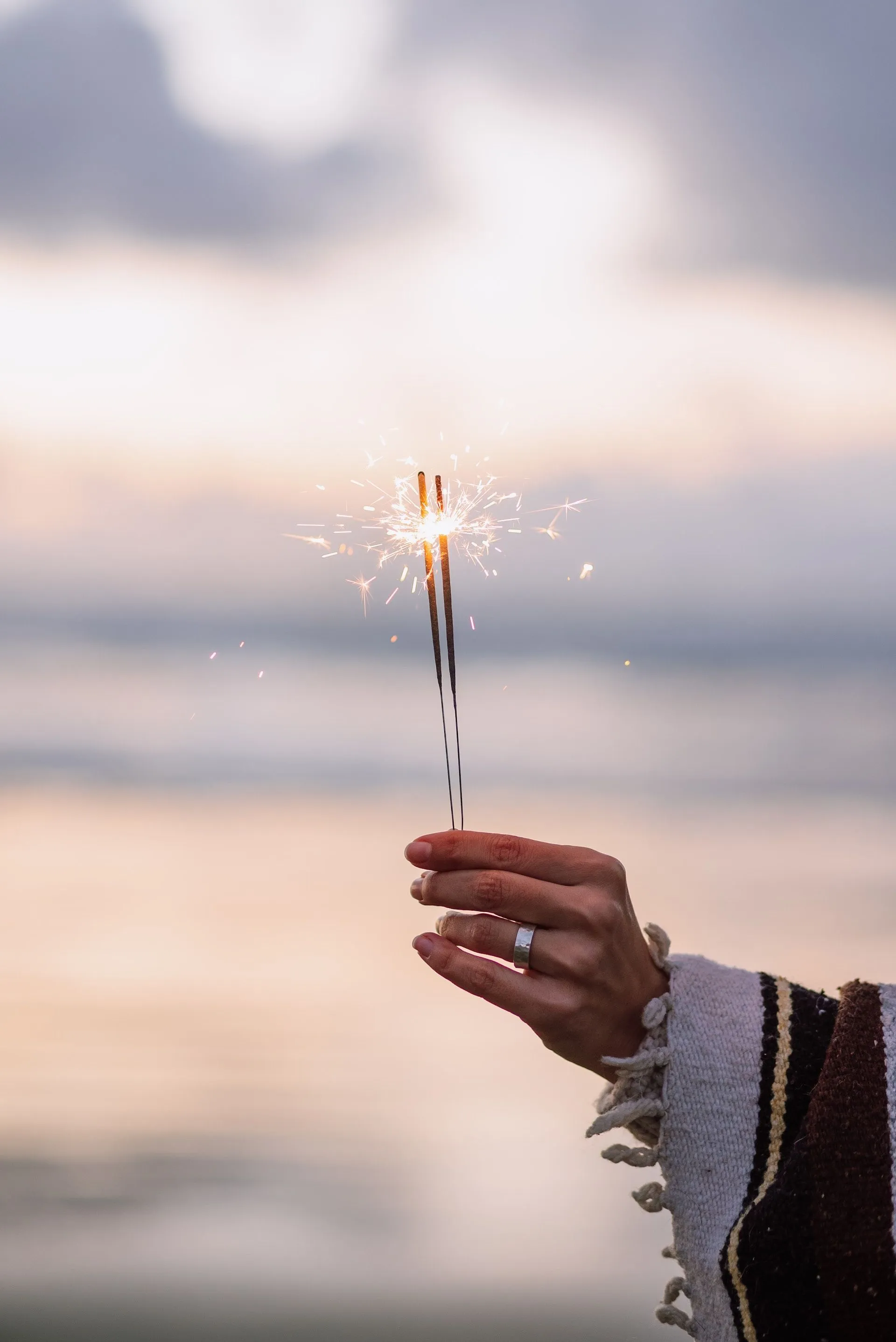 A person holding a sparkler