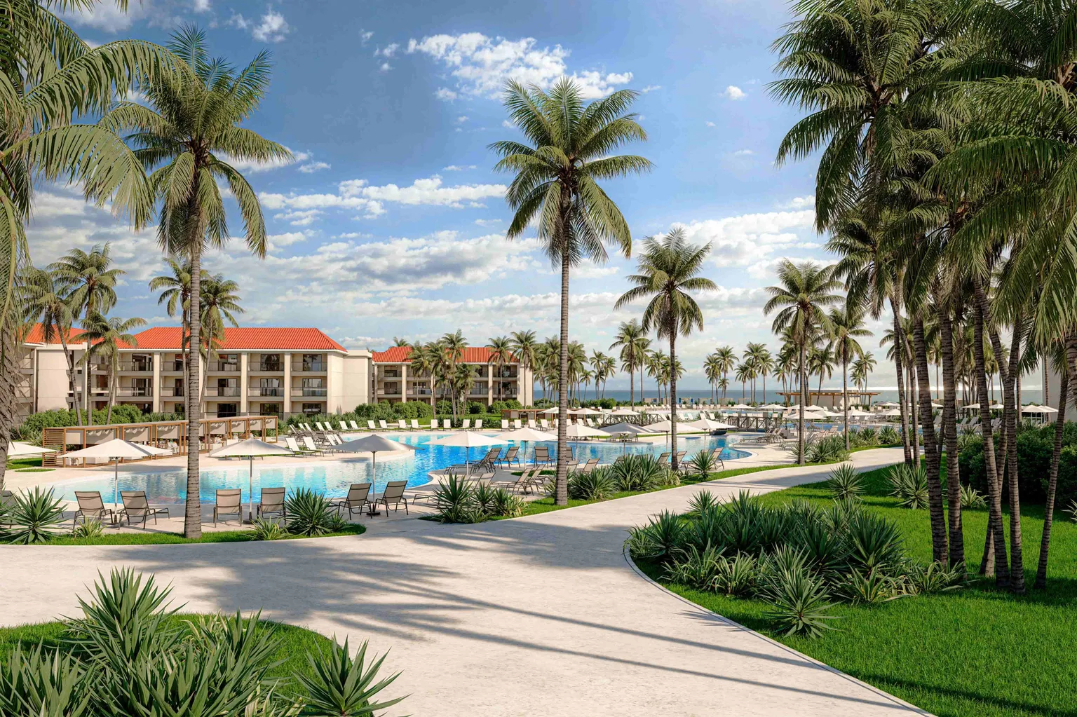 Hyatt Vivid Punta Cana pools framed by palm trees along the beachfront.